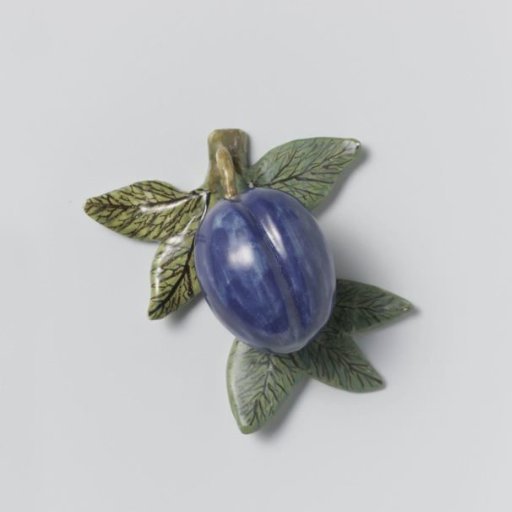 Plum of polychrome painted faience