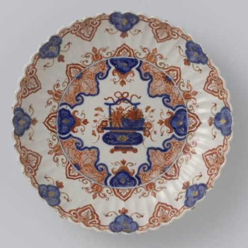 Bowl, decorated with flower basket within a lambrequin border