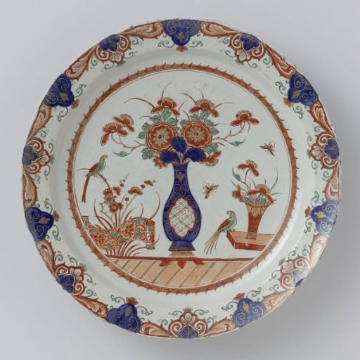 Plate of multicoloured painted faience