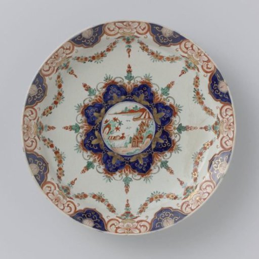 Plate of multicoloured painted faience