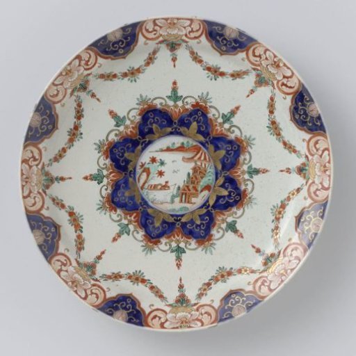 Plate of multicoloured painted faience
