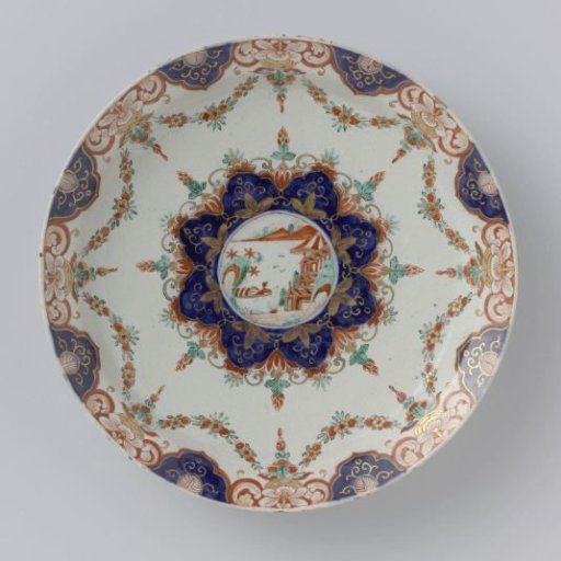 Plate of multicoloured painted faience