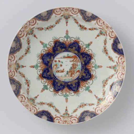 Plate of multicoloured painted faience