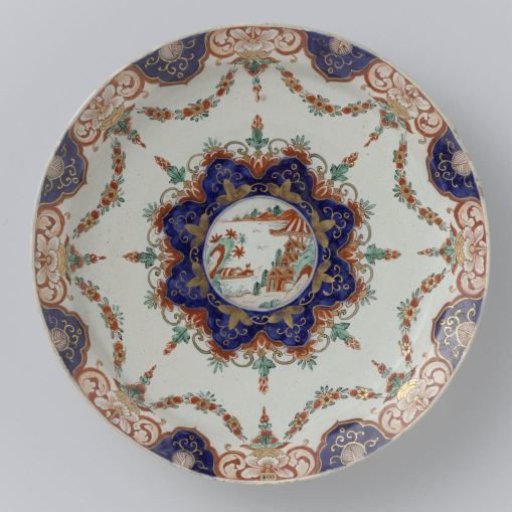 Plate of multicoloured painted faience