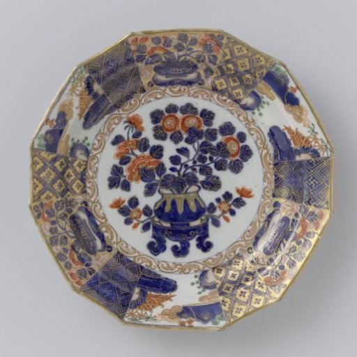 Plate of multicoloured painted faience