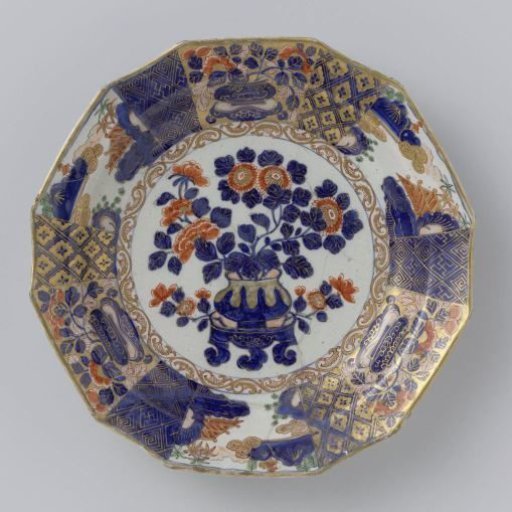 Plate of multicoloured painted faience