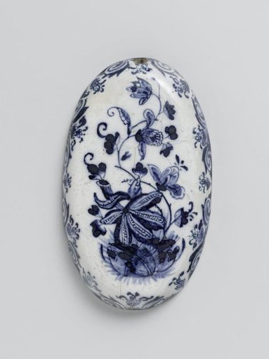 Oval brush-back of faience