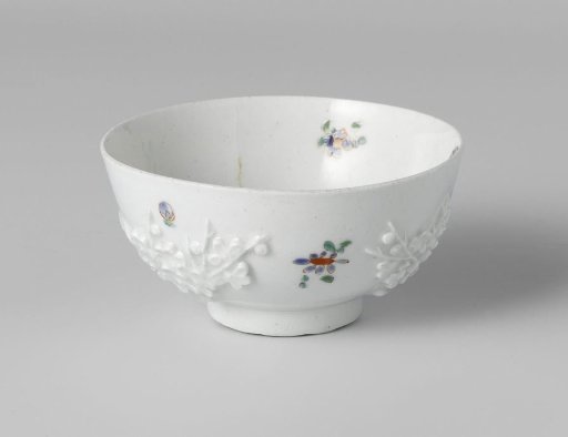 Bowl with relief decoration and some painted straw flowers