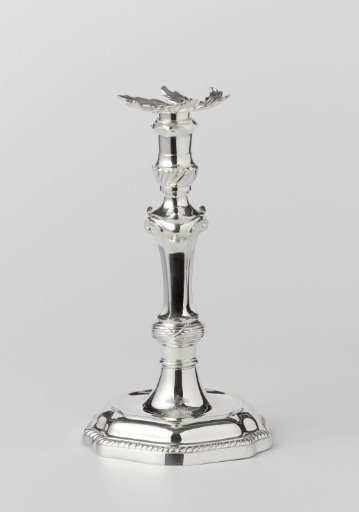 Silver candelabrum with hexagonal base and stem. Drip pan in the form of a lobed leaf. Coat of arms of Rotterdam engraved on the base