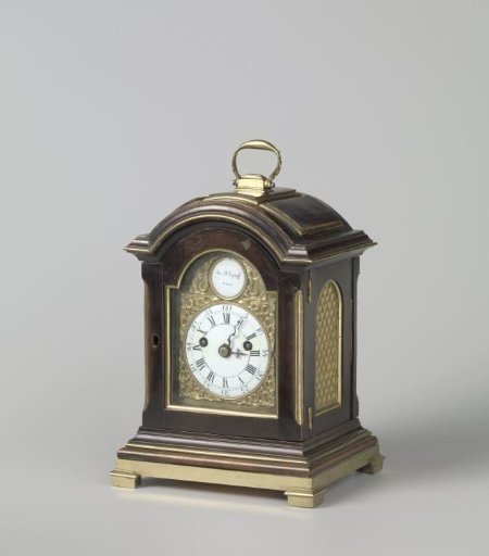 Table clock in a walnut case with brass fittings