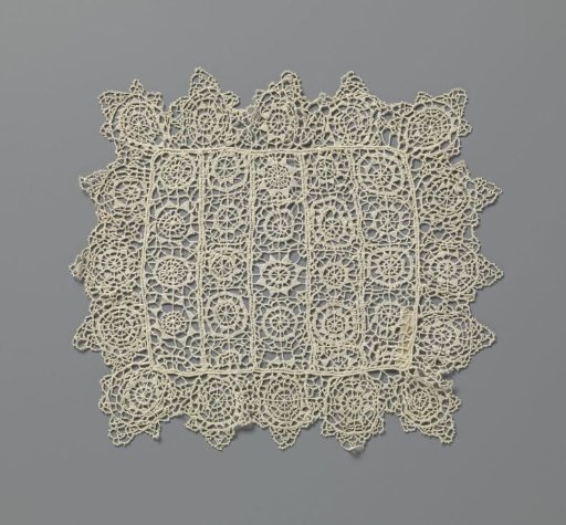 Pall of needle lace with geometric motifs and pointed tips
