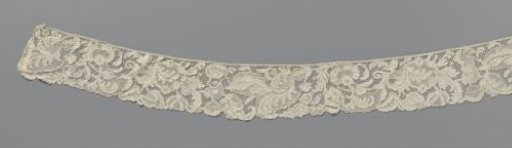 Strip of needle lace with curled feather-shaped leaves