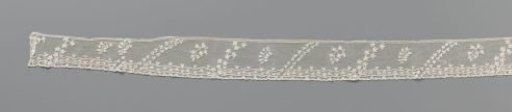 Strip of needle lace with double diagonal lines and leafy branches