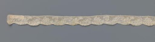 Strip of bobbin lace with a plume-shaped flower on a curved stem