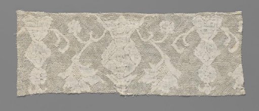 Strip of bobbin lace with vases and flaming flowers