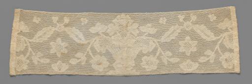 Strip of bobbin lace with a flowerpot