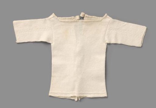 Knitted waistcoat of white cotton, with stocking stitch and cross borders and three times two ribbon ties