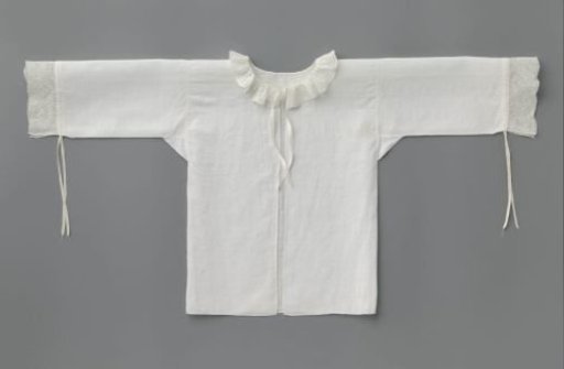 Children's shirt of linen, trimmed with lace and ribbon ties along the long sleeve and neck