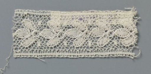 Strip of bobbin lace with interlinked three-lobed leaves