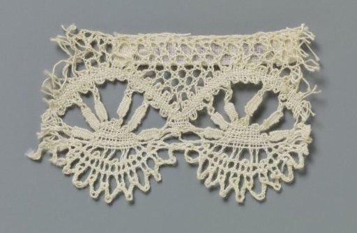 Strip of bobbin lace with rising sun