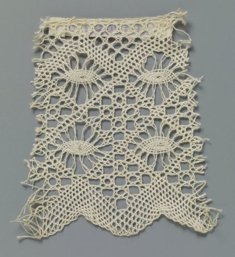 Strip of bobbin lace with pointed ovals in four rows of openwork diamonds