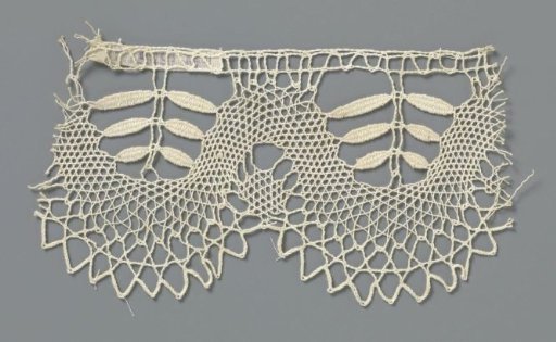 Strip of bobbin lace with three double leaves on a branch in a U-shaped shell