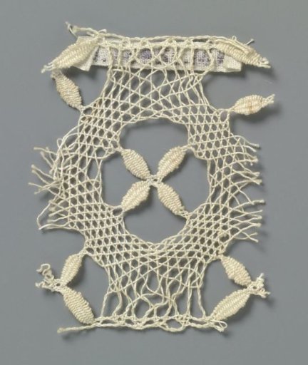 Strip of bobbin lace with cross of four leaves