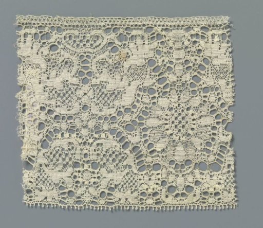Strip of machine-made lace with sunflower and candelabra motif with feathered leaf scrolls