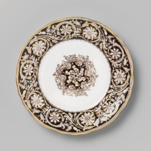 Plate of hard-baked earthenware with purple and gold decorations