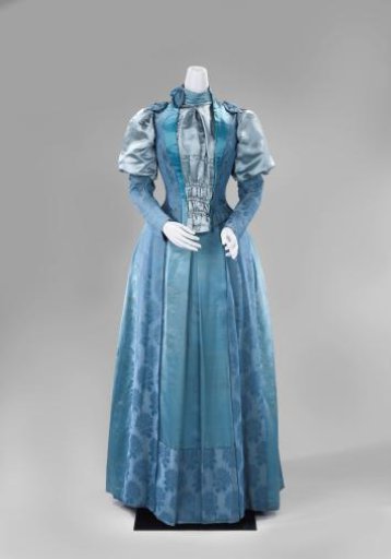 Body with long sleeve of grey-blue taffeta with woven (?) floral motif, trimmed with smooth blue silk in various shades and short extra sleeve of smooth silk