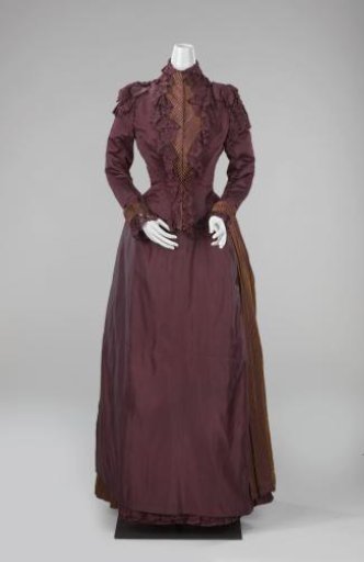 Skirt of burgundy satin, decorated with narrow yellow velvet stripes; petticoat of slightly lighter taffeta.