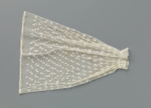 Under-sleeve of appliqué lace with a scattered pattern of an oval flower on a stem with two leaves