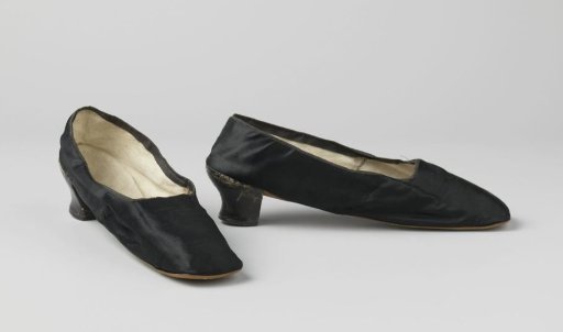 Lady's shoe of black satin trimmed with black grosgrain ribbon