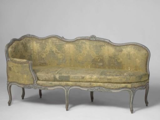 Sofa upholstered in silk with a pattern of Chinese figures on a yellow ground