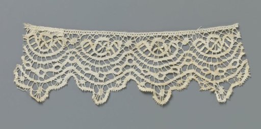 Strip of bobbin lace with circle in a horizontal arch above three wavy lines