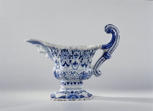 Jug with handle and mask, painted with floral and foliate motifs