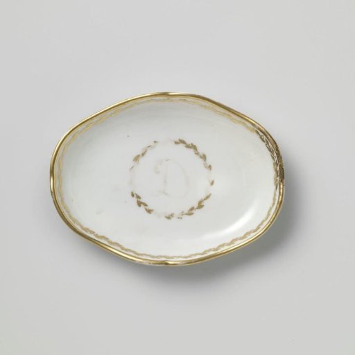 Saucer with a D and foliate scrolls