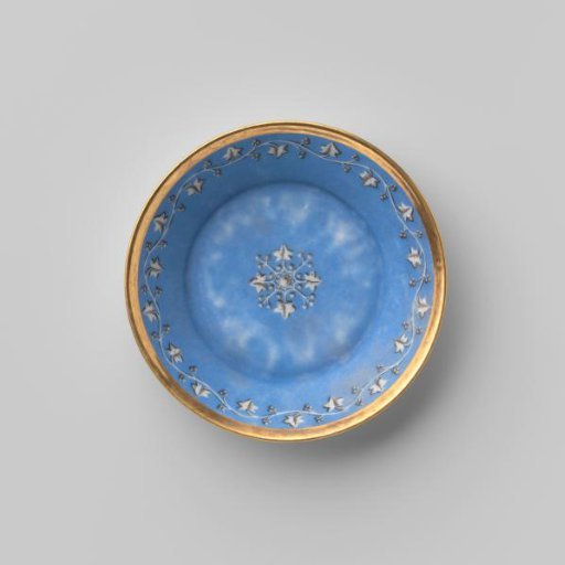 Saucer with a foliate scroll on a matt blue ground