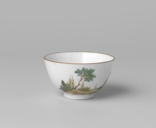 Cup with a group of figures looking at a hot air balloon