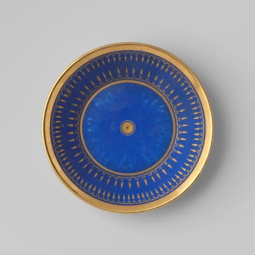 Saucer with ornamental borders on a blue ground