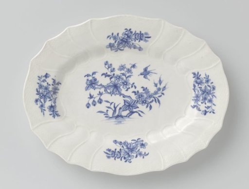 Dish with flowering plants and flower sprays