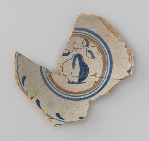Fragment of a plate, painted in blue under the glaze with a pear