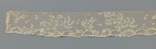 Strip of appliqué lace with flower branches above a border of oval cartouches
