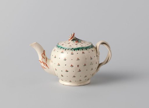 Teapot of hard-baked earthenware with a multicolored decoration on the glaze, creamware