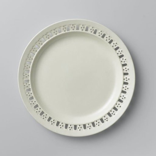 Round plate of hard-fired earthenware; creamware.