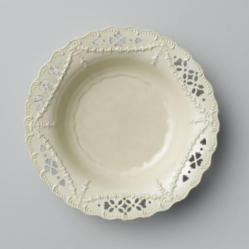 Plate of hard-baked earthenware, Leeds creamware with pierced rim.