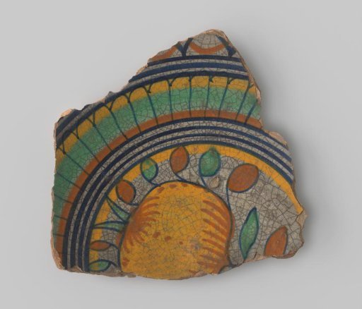Fragment of a earthenware dish, decorated with pomegranates