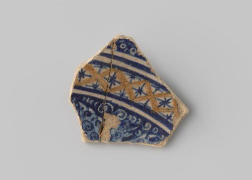Majolica sherd with blue and yellow decoration