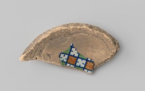 Majolica sherd with blue, yellow and green decoration