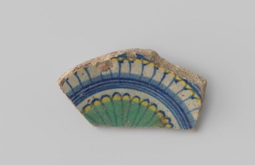 Majolica sherd with blue, yellow and green decoration